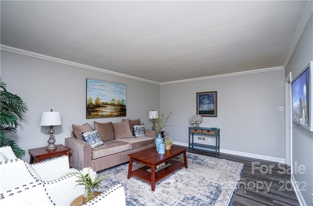 1829 Cathey Road Charlotte, NC 28214 - Photo 22 of 46 a living room with furniture and wooden floor