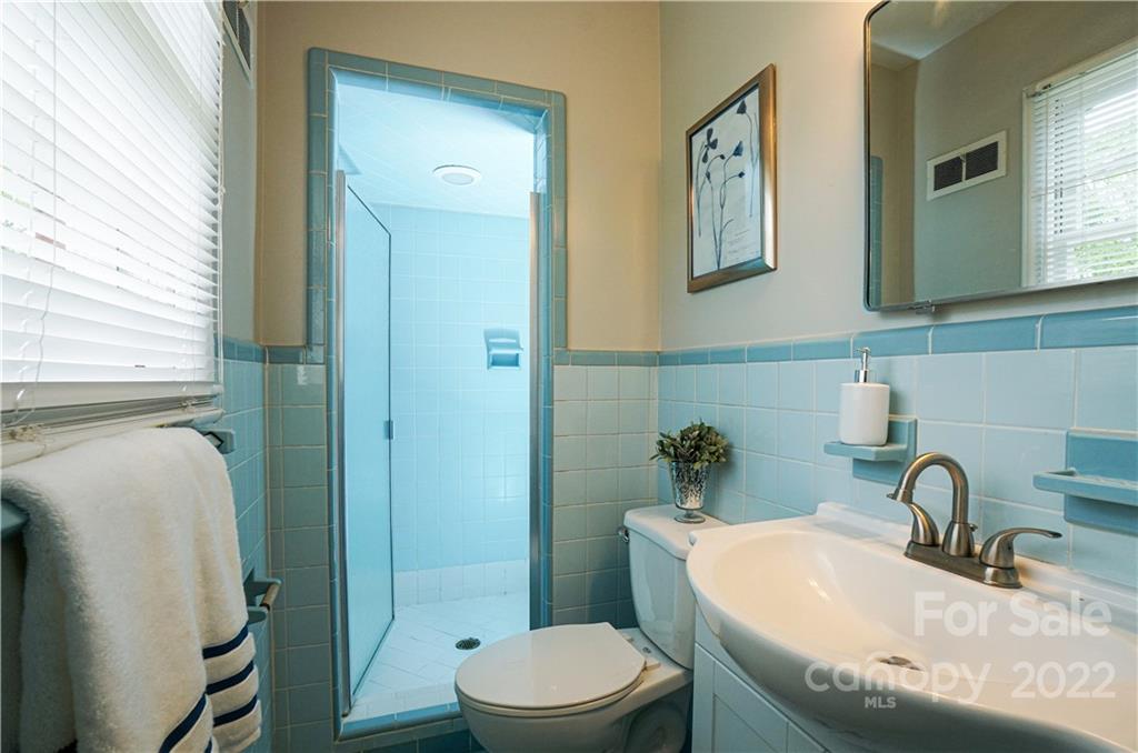 1829 Cathey Road Charlotte, NC 28214 - Photo 34 of 46 a bathroom with a granite countertop sink toilet and mirror
