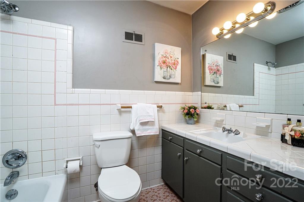 1829 Cathey Road Charlotte, NC 28214 - Photo 36 of 46 a bathroom with a toilet sink and mirror
