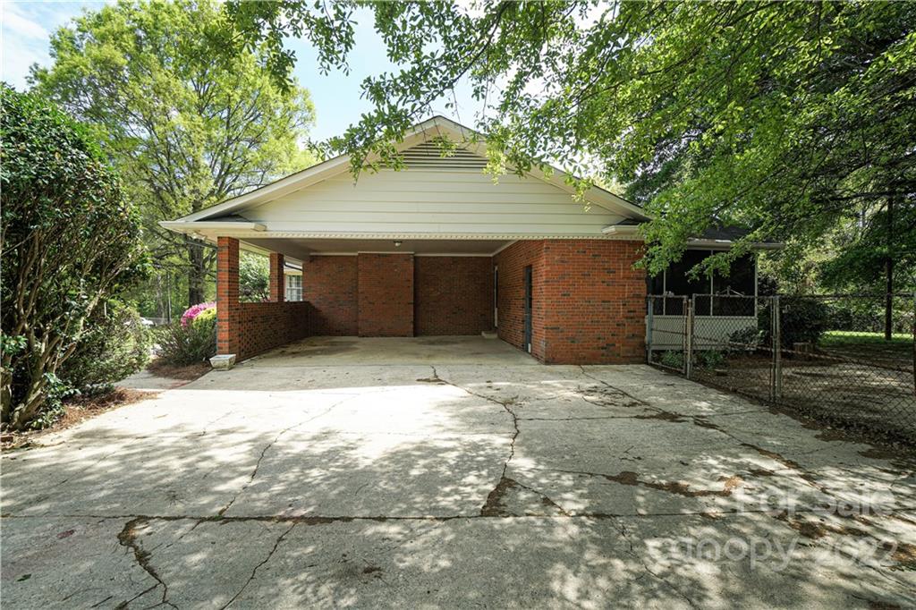 1829 Cathey Road Charlotte, NC 28214 - Photo 38 of 46 a house with a tree in front of it