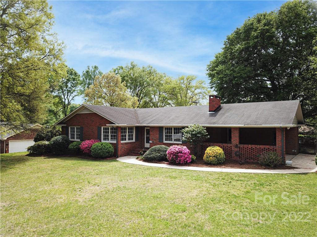 1829 Cathey Road Charlotte, NC 28214 - Photo 46 of 46 a view of a house with a yard and potted plants