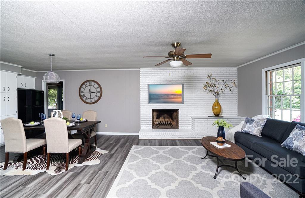1829 Cathey Road Charlotte, NC 28214 - Photo 6 of 46 a living room with furniture and a fireplace