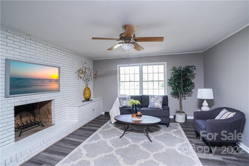 1829 Cathey Road Charlotte, NC 28214 - Photo 7 of 46 a living room with furniture and a fireplace