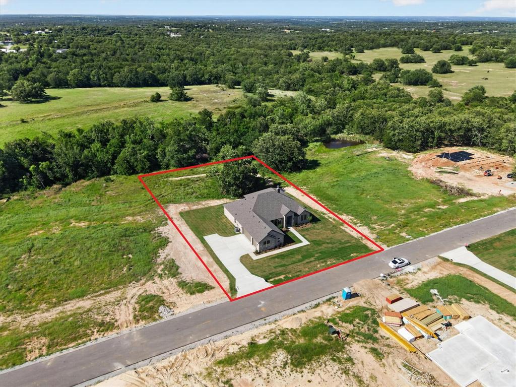 409 Mcalpine Springtown, TX 76082 - Photo 38 of 38 Single-story residence featuring a gray exterior and a dark gray shingle roof