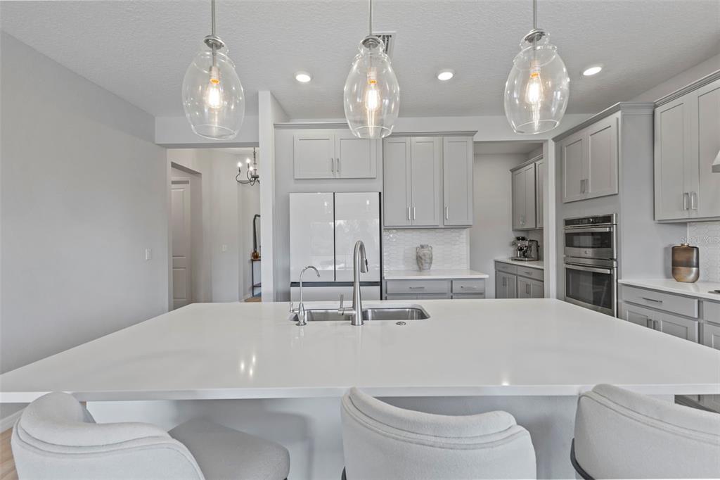 5679 Blue Reef Place Nokomis, FL 34275 - Photo 14 of 46 a bathroom with a sink a toilet and a large mirror