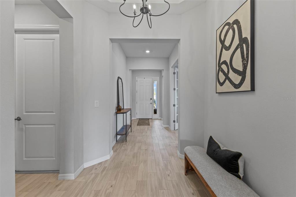 5679 Blue Reef Place Nokomis, FL 34275 - Photo 17 of 46 a view of a hallway with wooden floor and closet