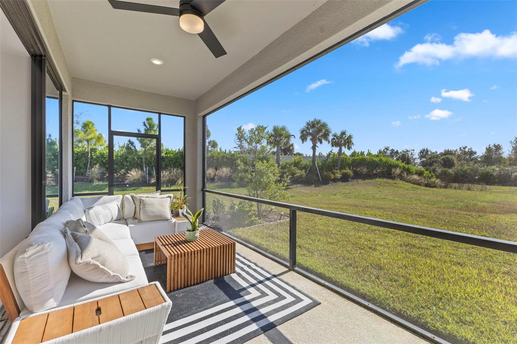 5679 Blue Reef Place Nokomis, FL 34275 - Photo 18 of 46 a balcony with furniture and a view of lake