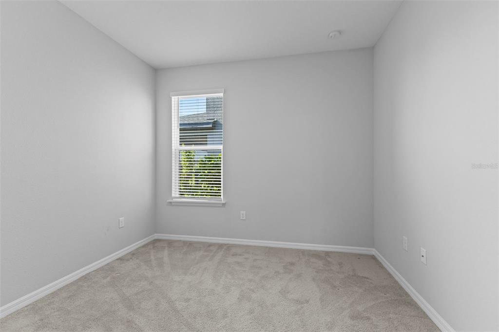 5679 Blue Reef Place Nokomis, FL 34275 - Photo 31 of 46 an empty room with a window