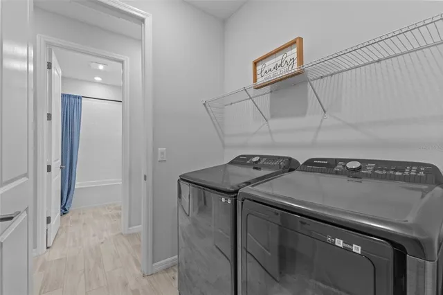 a utility room with dryer and washer