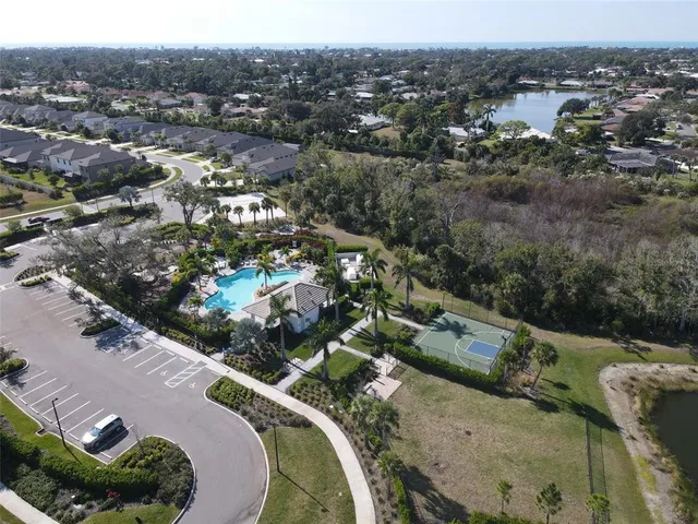 an aerial view of a house with a yard