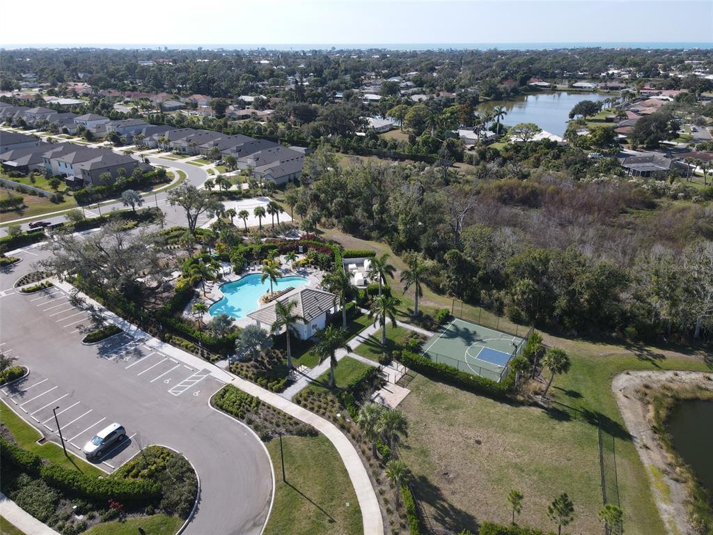 5679 Blue Reef Place Nokomis, FL 34275 - Photo 38 of 46 an aerial view of a house with a yard