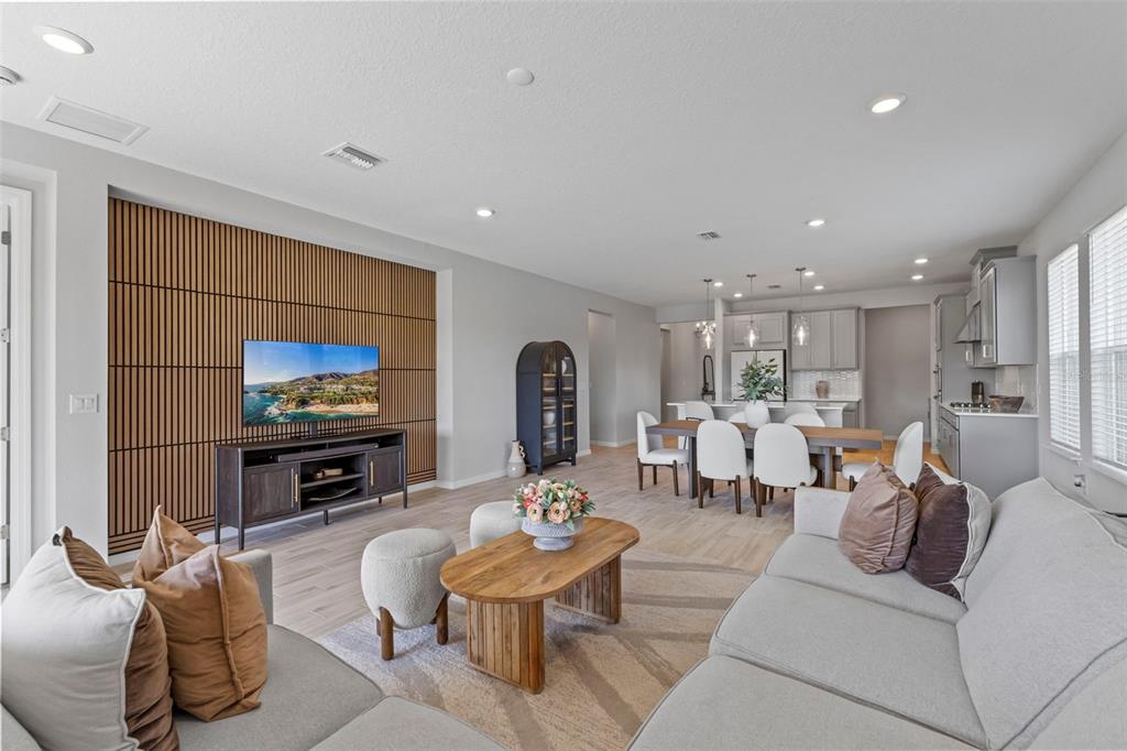 5679 Blue Reef Place Nokomis, FL 34275 - Photo 5 of 46 a living room with furniture and a flat screen tv