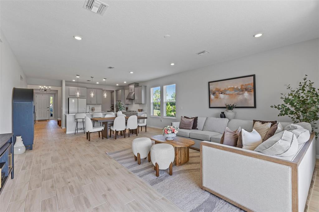 5679 Blue Reef Place Nokomis, FL 34275 - Photo 7 of 46 a living room with furniture and a table