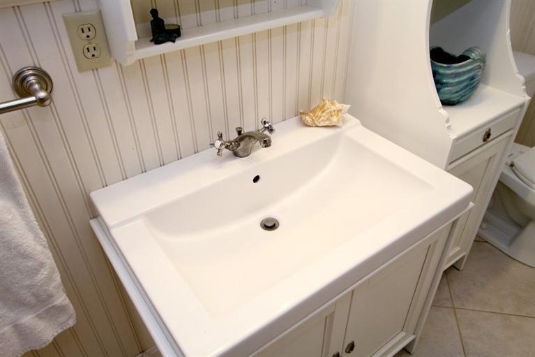 77 Sheffield Road Brewster, MA 02631 - Photo 13 of 26 a bathroom with a sink and mirror