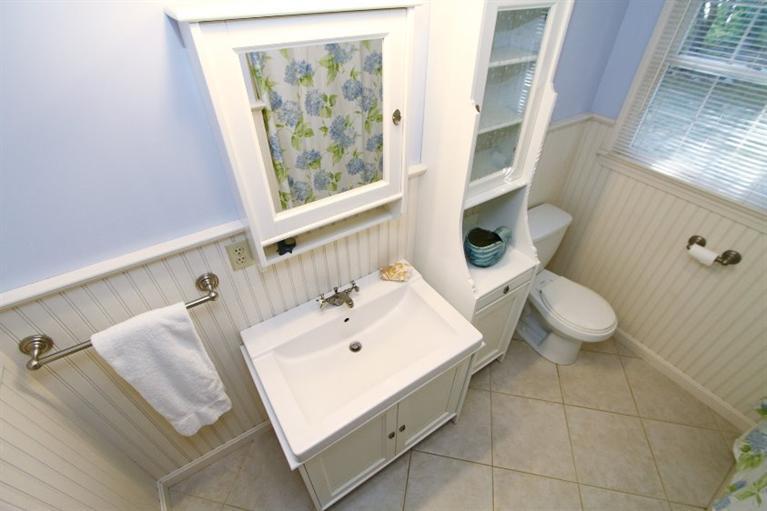 77 Sheffield Road Brewster, MA 02631 - Photo 14 of 26 a bathroom with a sink mirror and toilet