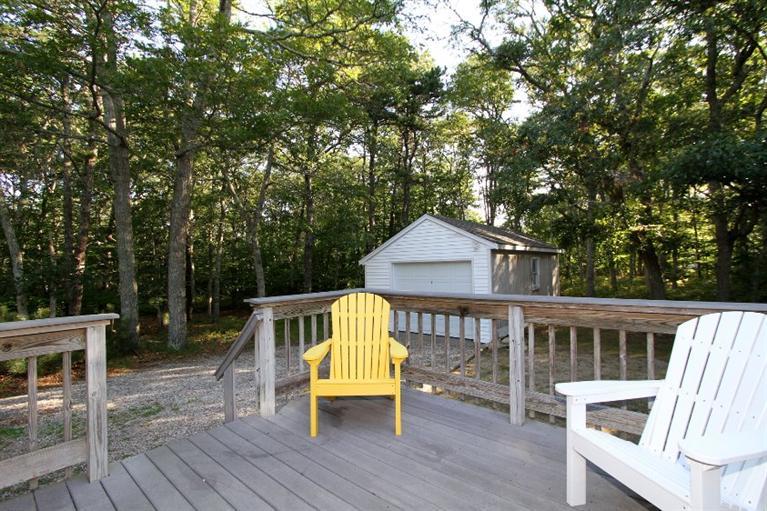 77 Sheffield Road Brewster, MA 02631 - Photo 23 of 26 a view of house with a deck and furniture