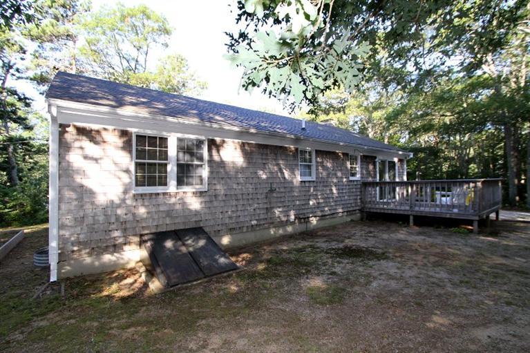 77 Sheffield Road Brewster, MA 02631 - Photo 26 of 26 a view of a house with a yard