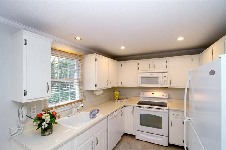 77 Sheffield Road Brewster, MA 02631 - Photo 3 of 26 a kitchen with a sink a white cabinets and a stove