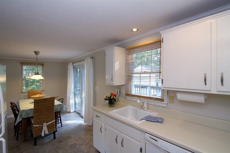 77 Sheffield Road Brewster, MA 02631 - Photo 5 of 26 a view of a kitchen and dining room