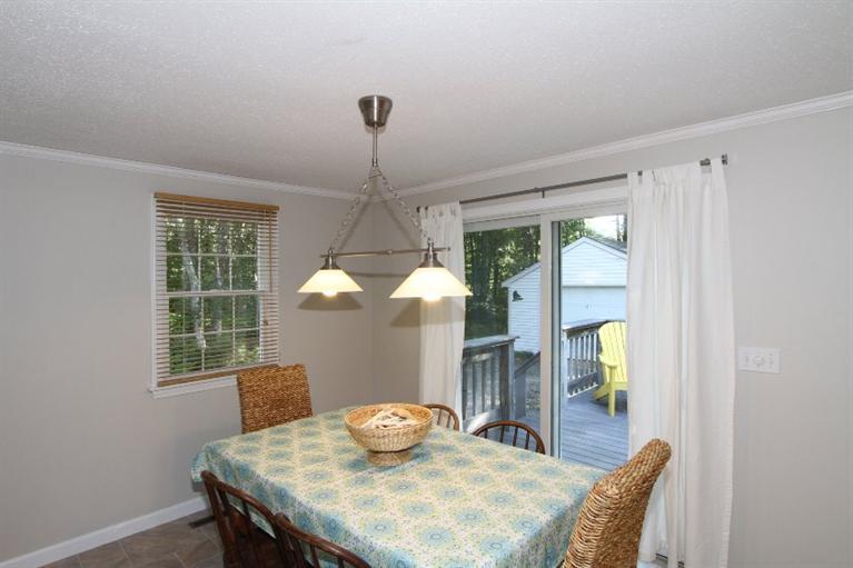 77 Sheffield Road Brewster, MA 02631 - Photo 6 of 26 a view of a dining room with furniture window and outside view