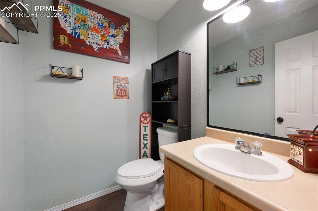 12206 Crystal Downs Road Peyton, CO 80831 - Photo 12 of 26 a bathroom with a sink and a toilet