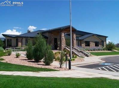 12206 Crystal Downs Road Peyton, CO 80831 - Photo 23 of 26 a front view of a house with a yard