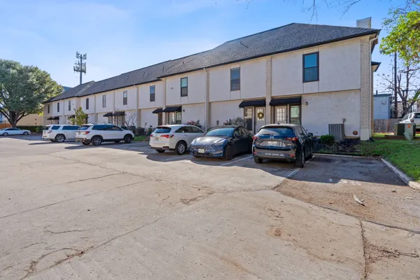 a view of a cars park in front of house