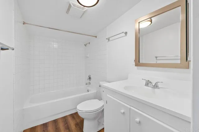 a bathroom with a sink a toilet and a bathtub