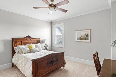 a bed room with a bed and a chair