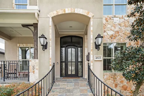 a view of a porch with a floor to ceiling window