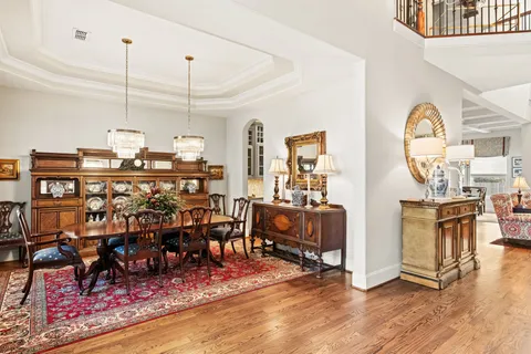 a view of a dining hall with lots of furniture and wooden floor