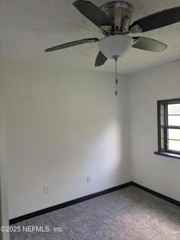 a view of a room with an empty space