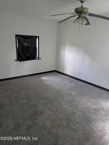 a view of a ceiling fan in a room