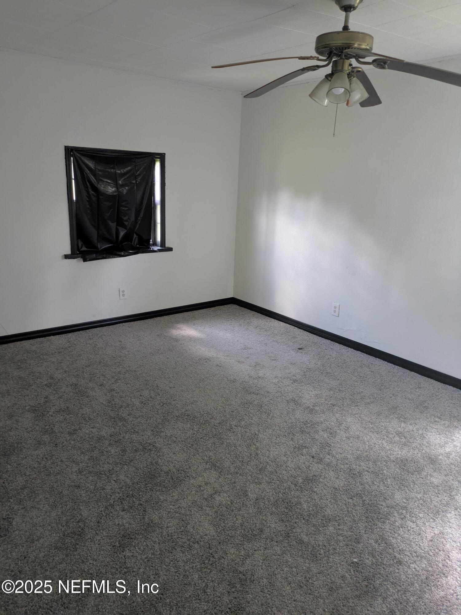 54559 Marlee Road Callahan, FL 32011 - Photo 22 of 33 a view of a ceiling fan in a room
