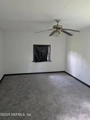 a bathroom with a sink toilet and mirror