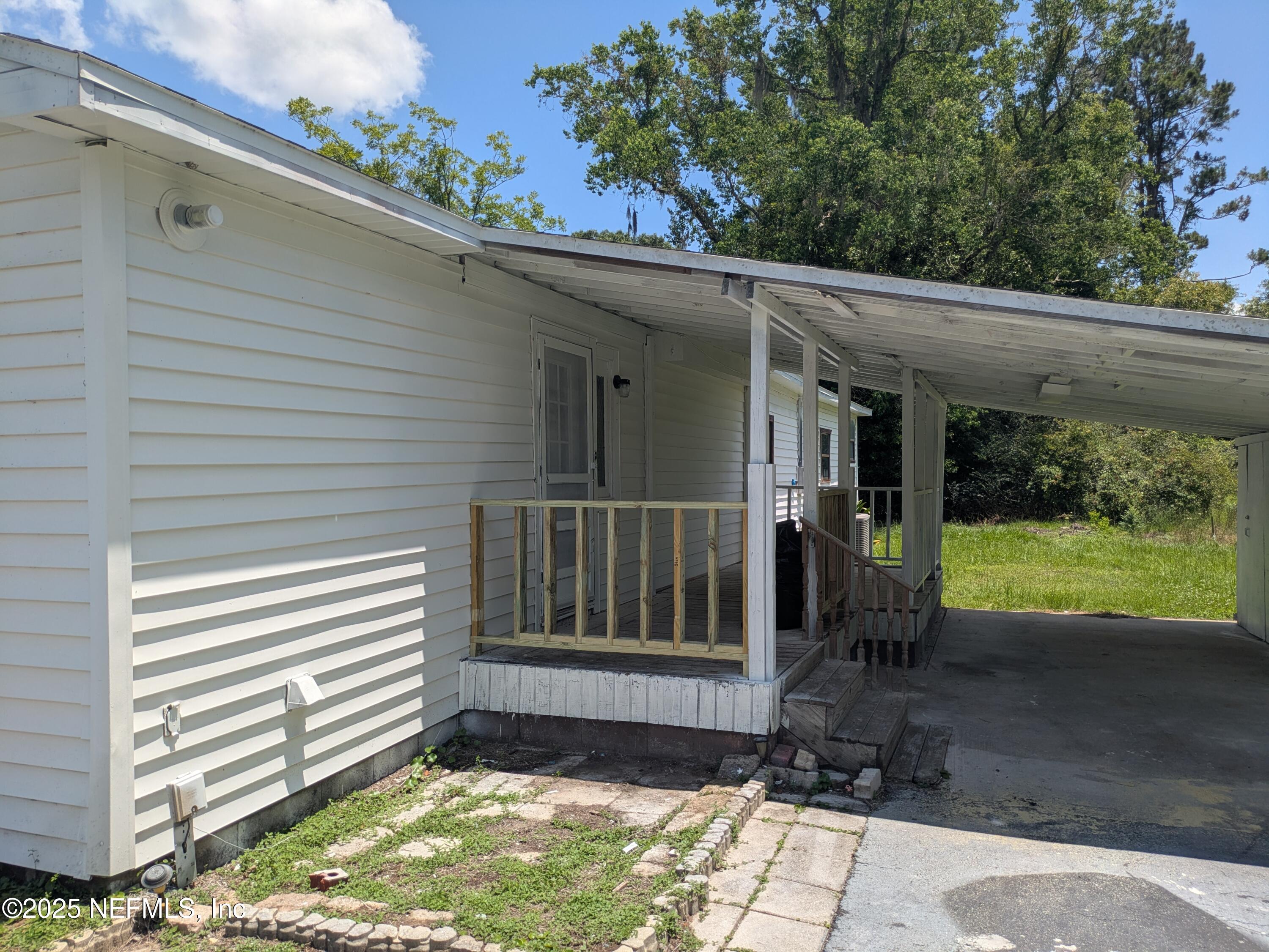 54559 Marlee Road Callahan, FL 32011 - Photo 5 of 33 a view of backyard with garden