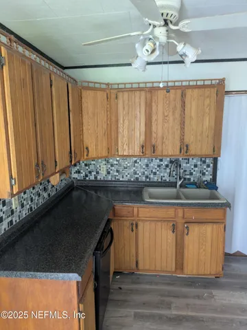 a kitchen with a sink and cabinets