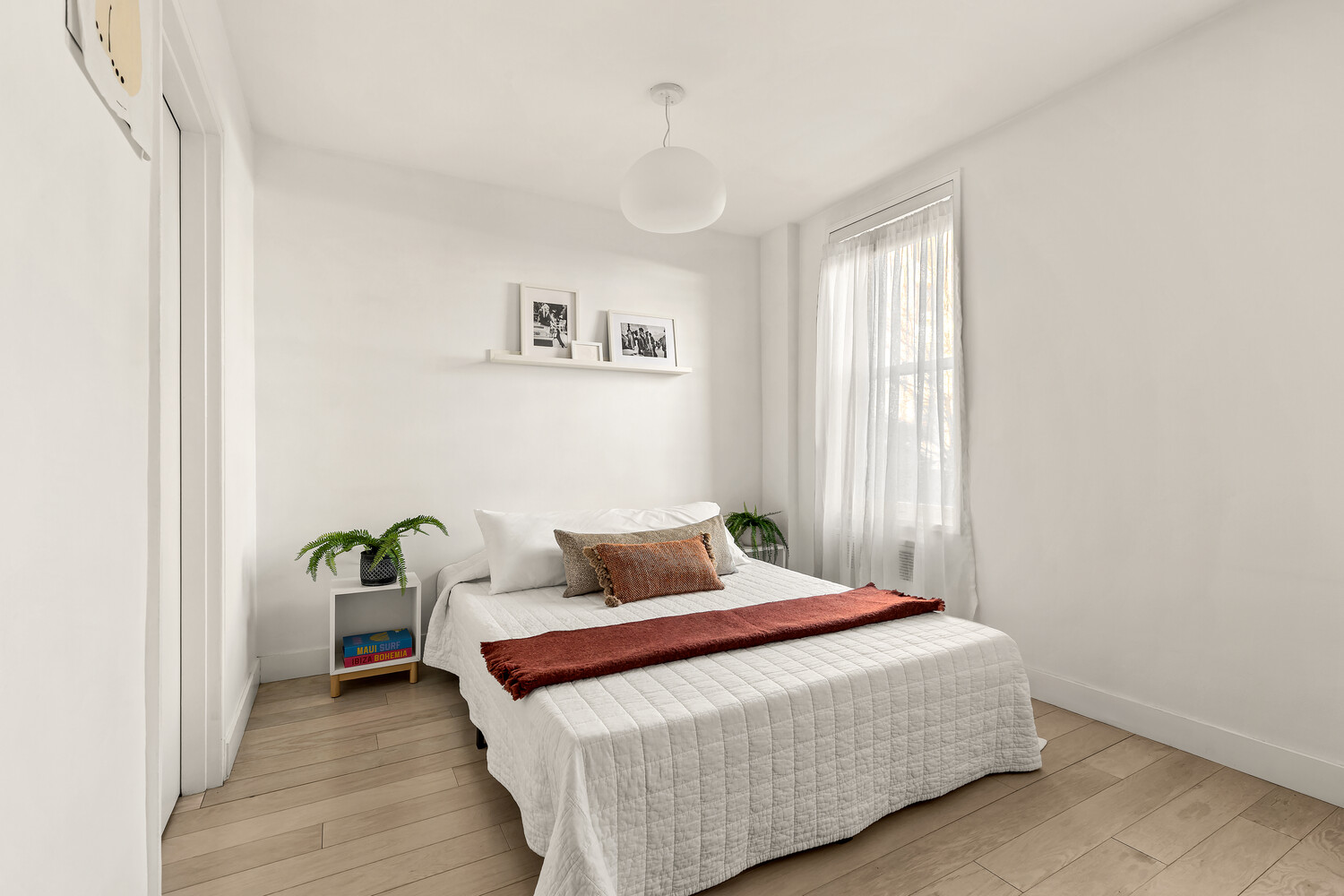 651 Vanderbilt Street, Unit 2R Brooklyn, NY 11218 - Photo 2 of 5 a bedroom with a bed and a window