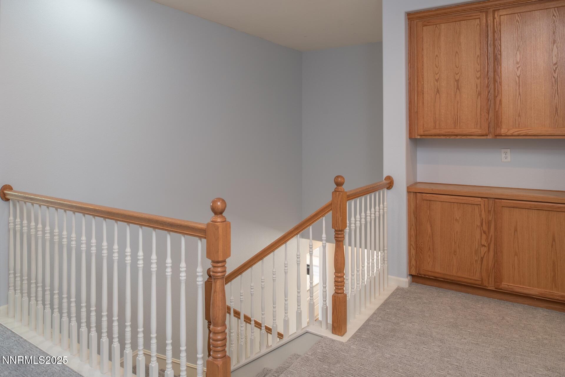 10630 Birch Point Court Reno, NV 89521 - Photo 20 of 42 a view of staircase with railing and white walls