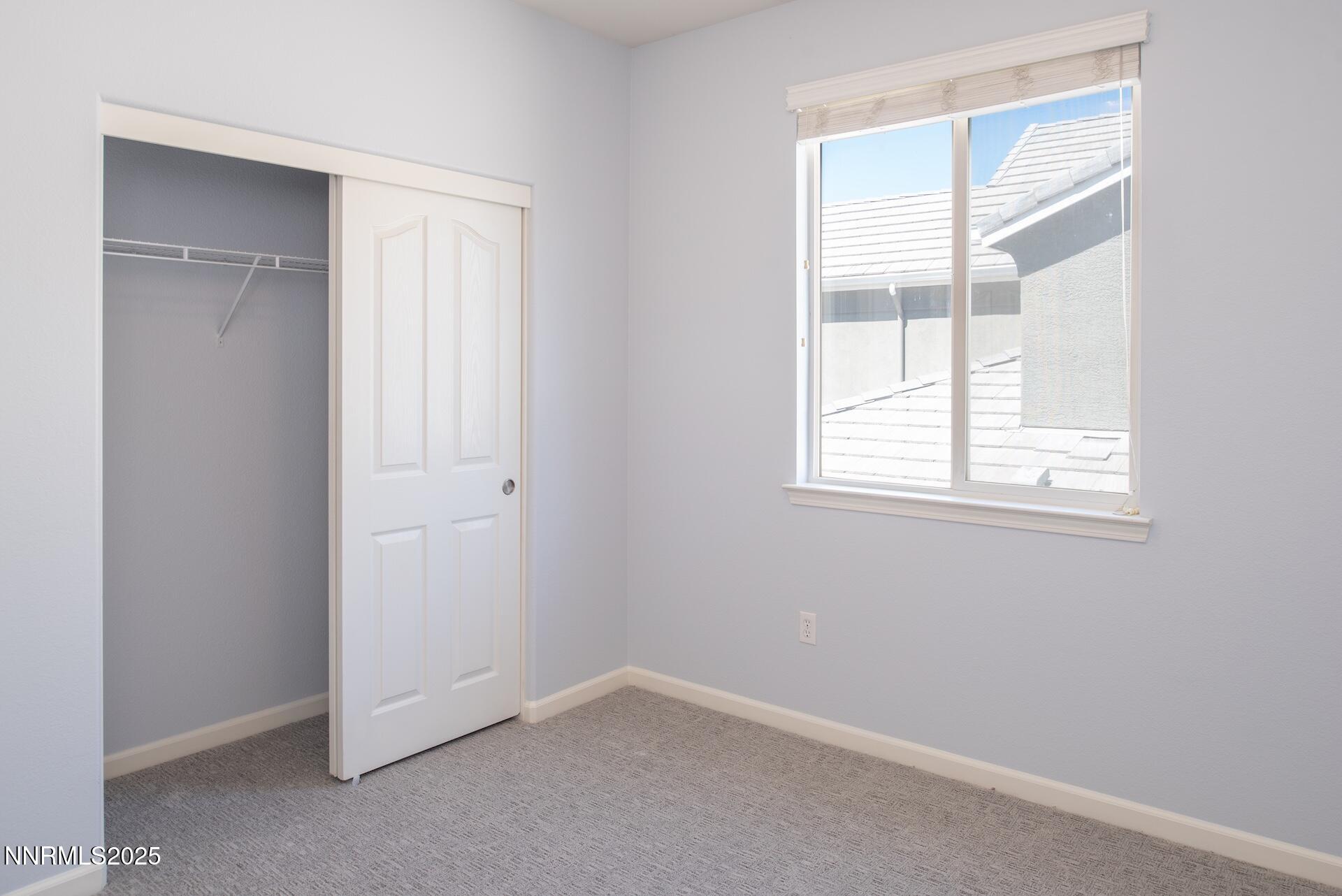 10630 Birch Point Court Reno, NV 89521 - Photo 24 of 42 an empty room with windows and closet