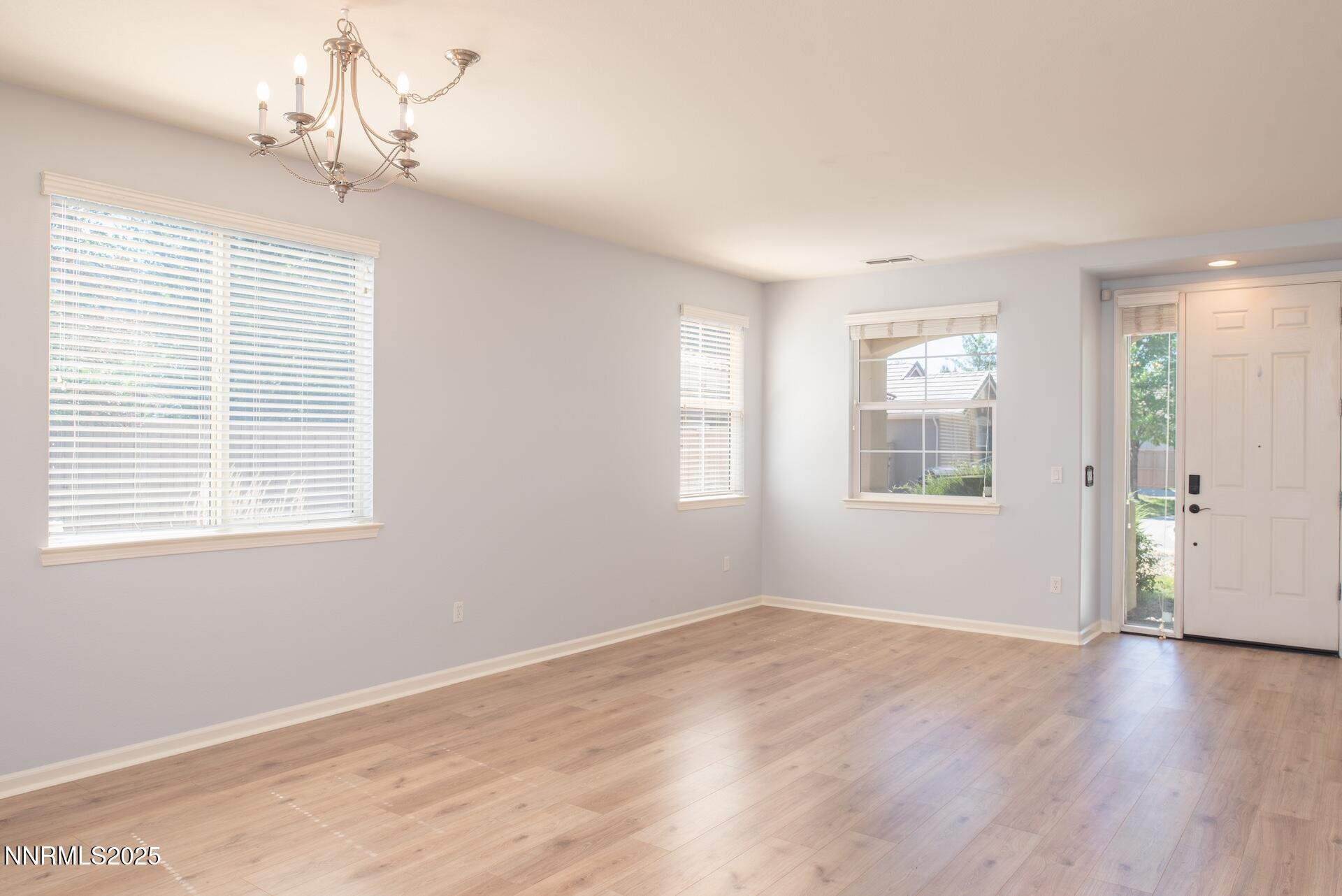 10630 Birch Point Court Reno, NV 89521 - Photo 3 of 42 a view of a room with wooden floor and windows