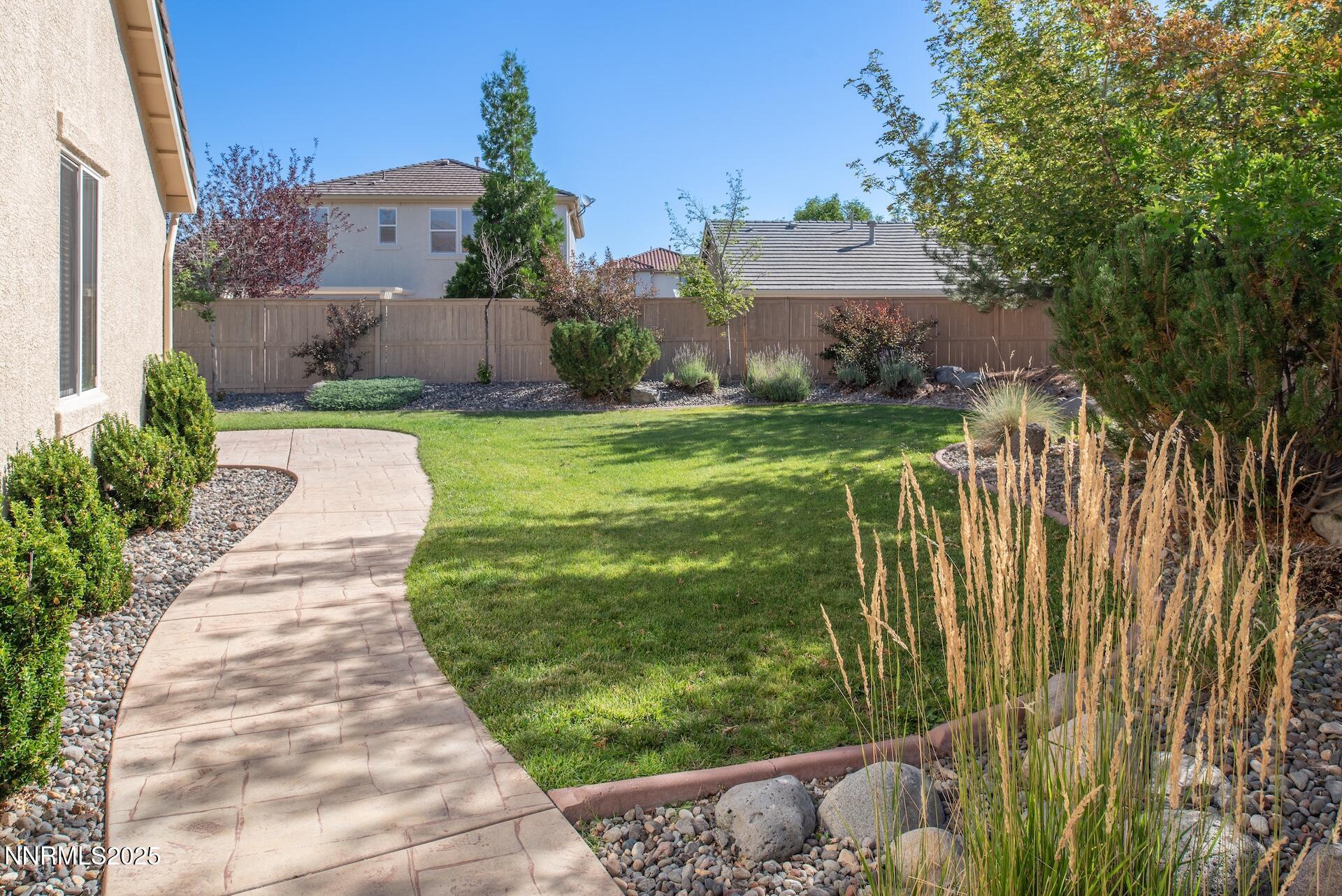 10630 Birch Point Court Reno, NV 89521 - Photo 36 of 42 a view of a garden with a building in the background