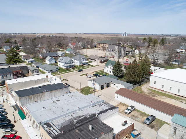 an aerial view of residential houses with outdoor space