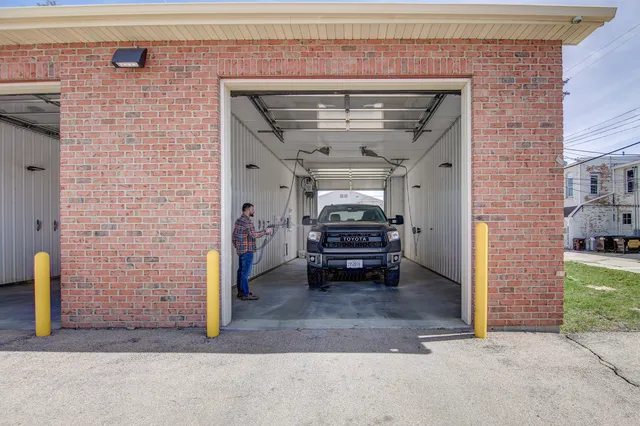 a view of a porch with wooden floor and fence