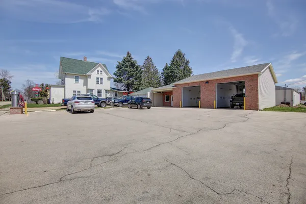 a view of a storage and utility room with dryer and washer