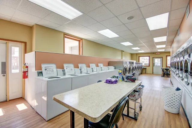 a kitchen with a stove top oven cabinets