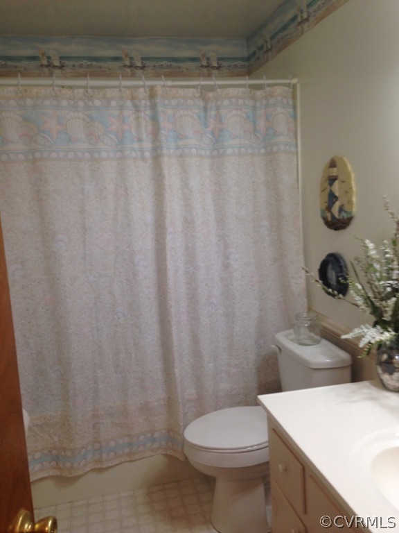 915 Yorkshire Road Colonial Heights, VA 23834 - Photo 12 of 13 a bathroom with a sink a toilet and shower curtain