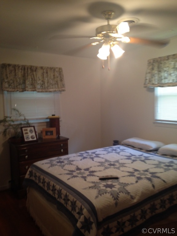915 Yorkshire Road Colonial Heights, VA 23834 - Photo 10 of 13 a bed sitting in a bedroom next to a window