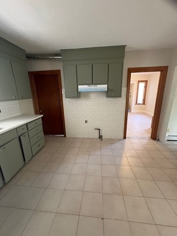 100 Prospect Street, Unit 1 Waltham, MA 02453 - Photo 4 of 12 a view of a livingroom with wooden floor and cabinet