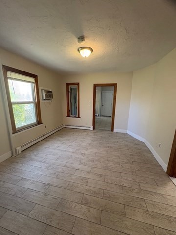 100 Prospect Street, Unit 1 Waltham, MA 02453 - Photo 8 of 12 a view of an empty room and window